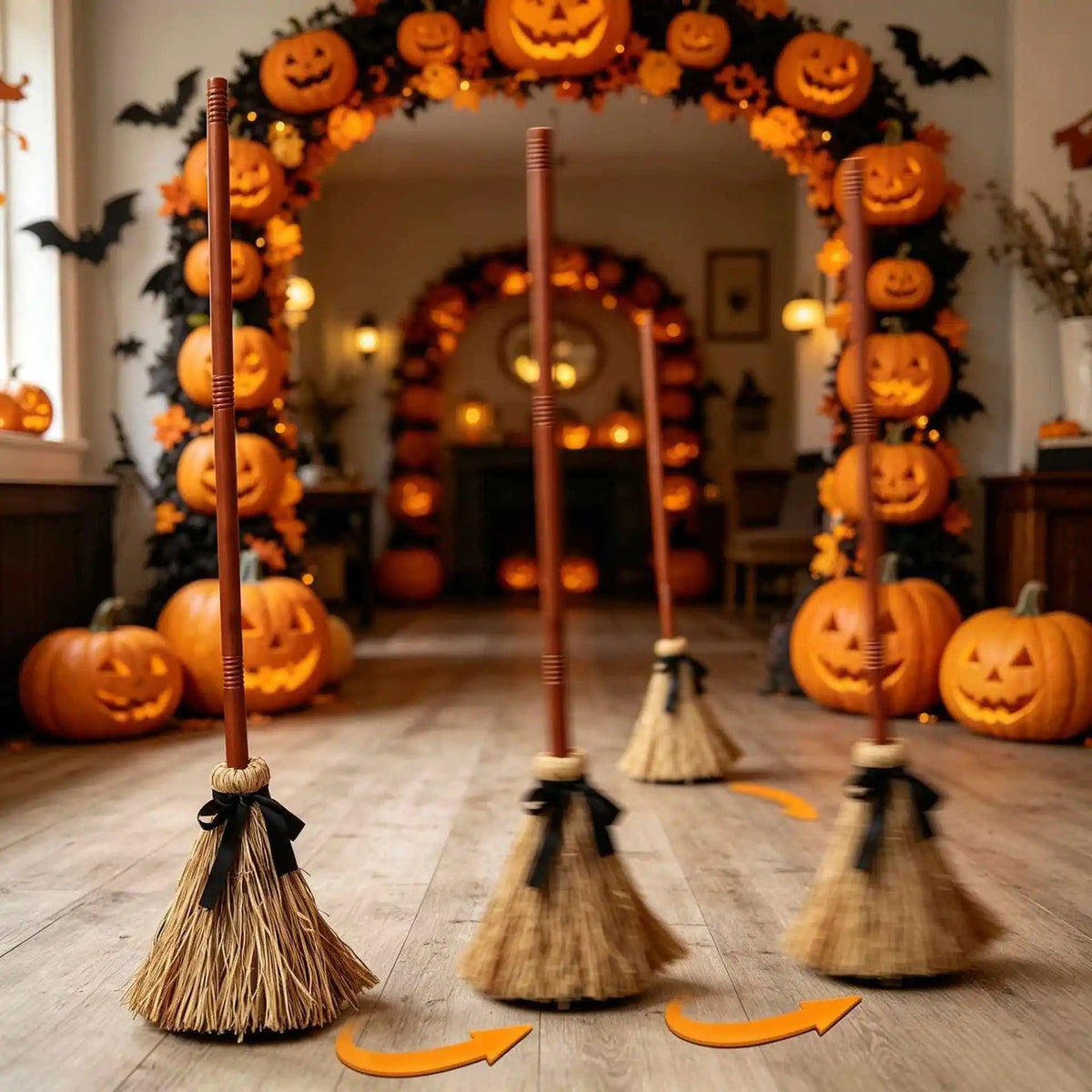 Halloween doorway layered with lit brooms and pumpkins