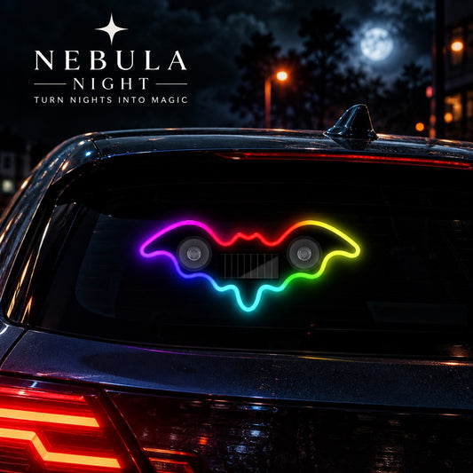 Solar Bat Car Light glowing on a car rear window at night