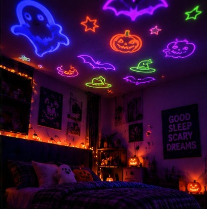 Halloween shapes projected across a bedroom ceiling