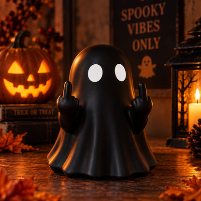 Rude Ghost Statue in black beside a jack-o-lantern and a Spooky Vibes Only sign